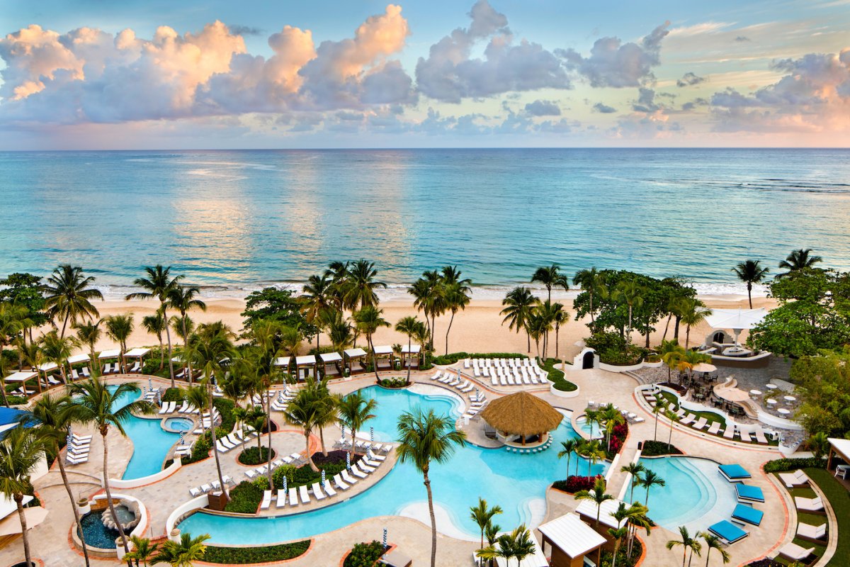 El San Juan Hotel's pool and beach at sunrise.