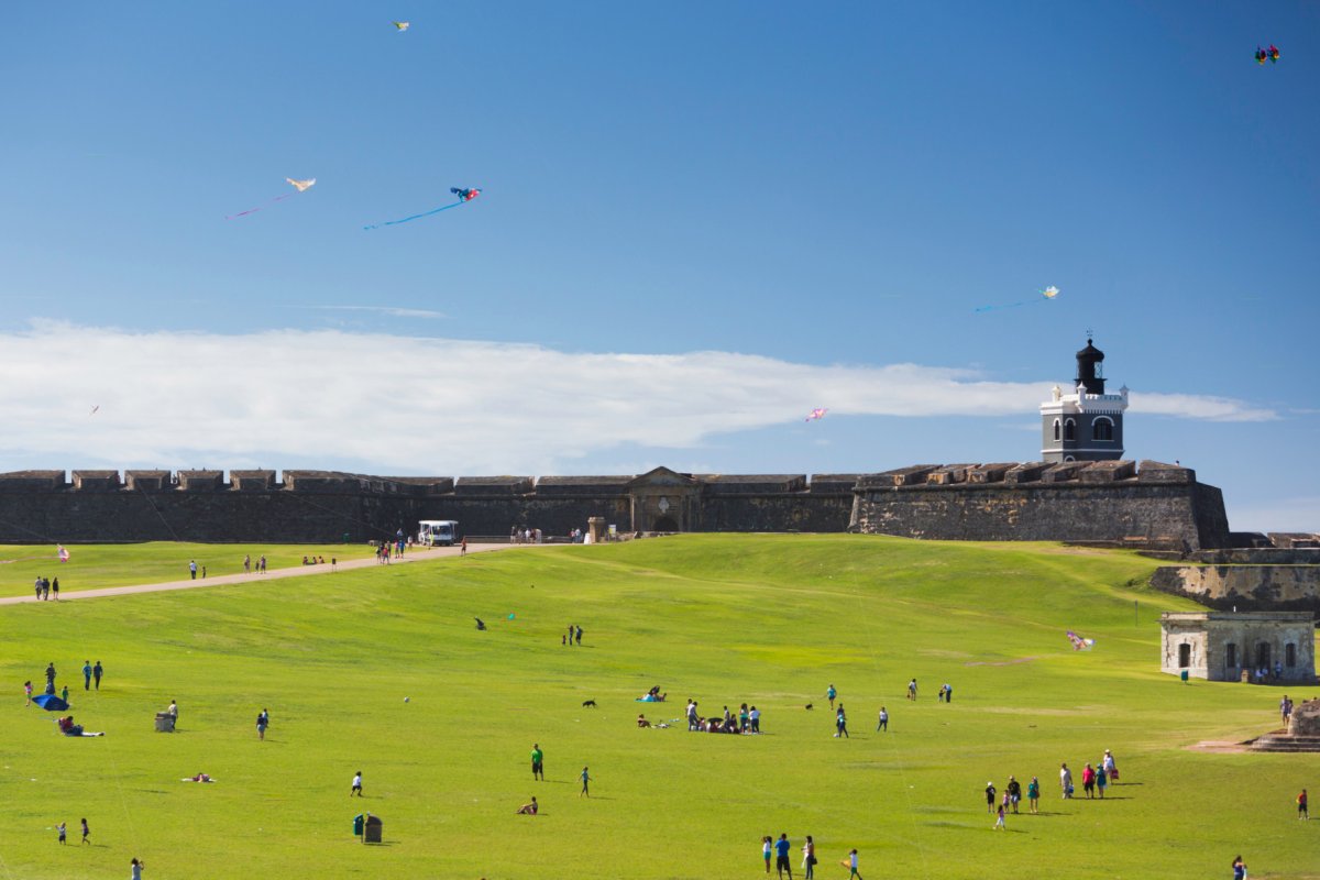 Visitors fly kites on the grounds of El Morro in Old San Juan.