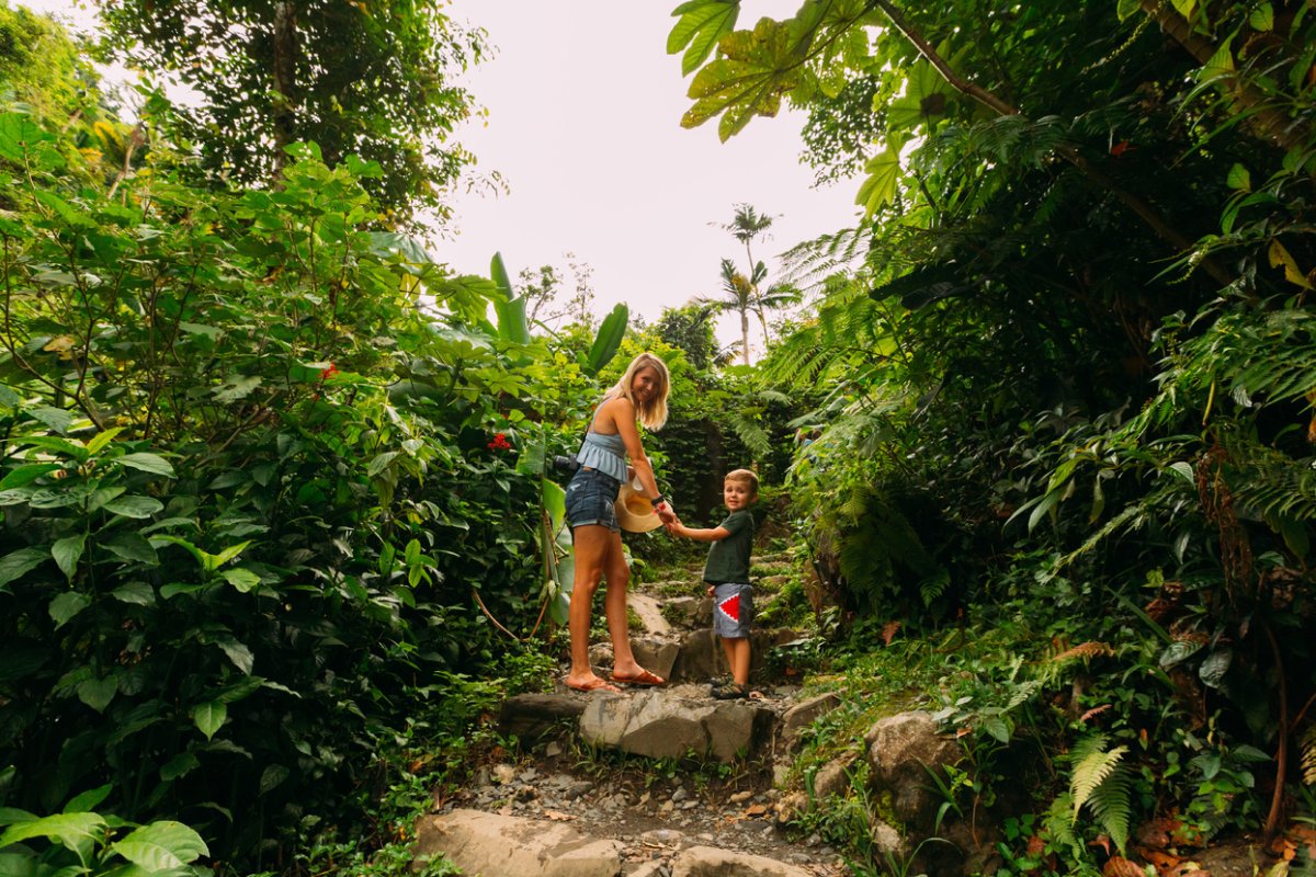 Mother and kid walking through one of El Yunque's trails.