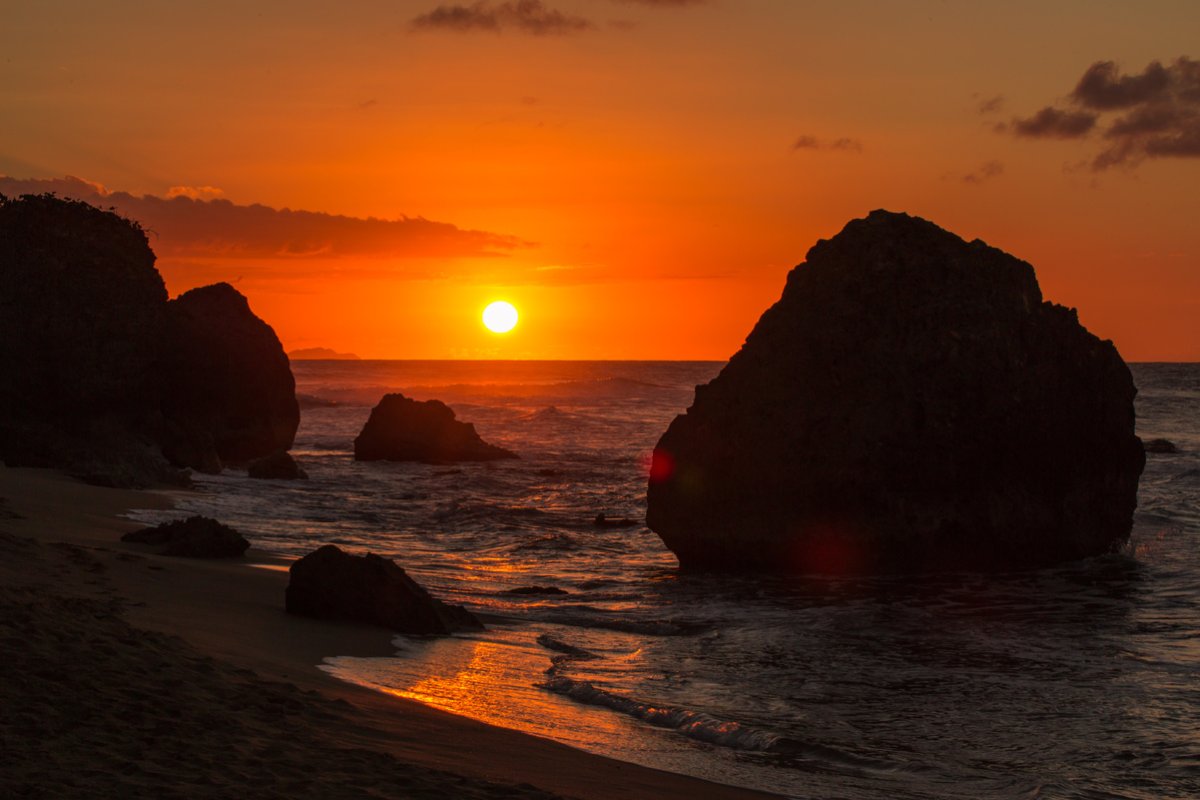 Survival Beach in Aguadilla has giant boulders that create rock sculptures and caves.