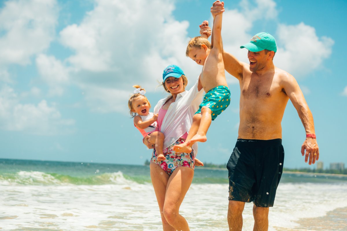 Family with toddlers at the beach