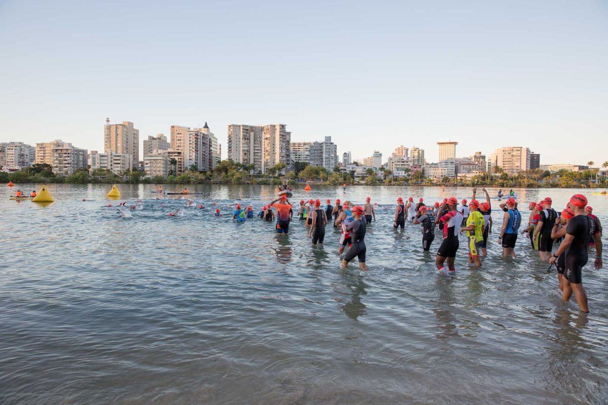 Competitors in the IRONMAN 70.3 Puerto Rico prepare to begin swimming in San Juan, Puerto Rico.