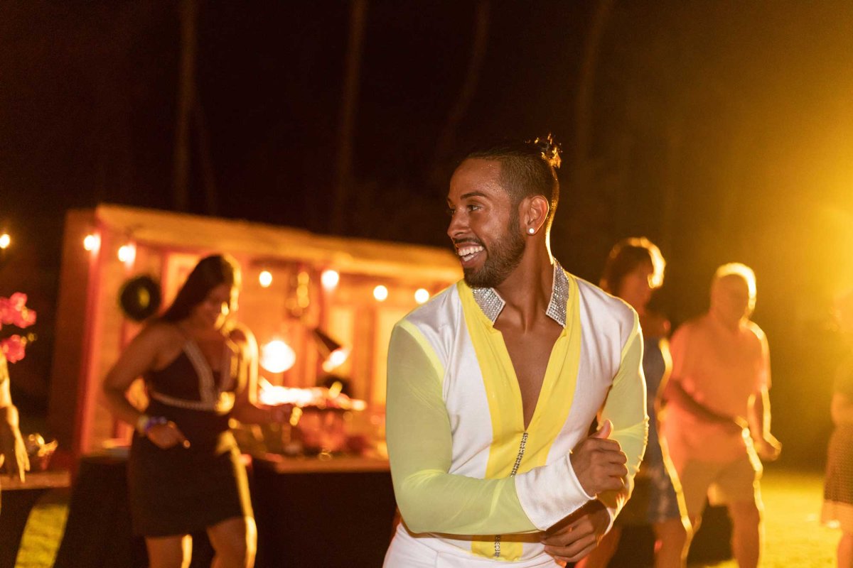 A salsa dancer leads a group in a dance at an event in Puerto Rico.