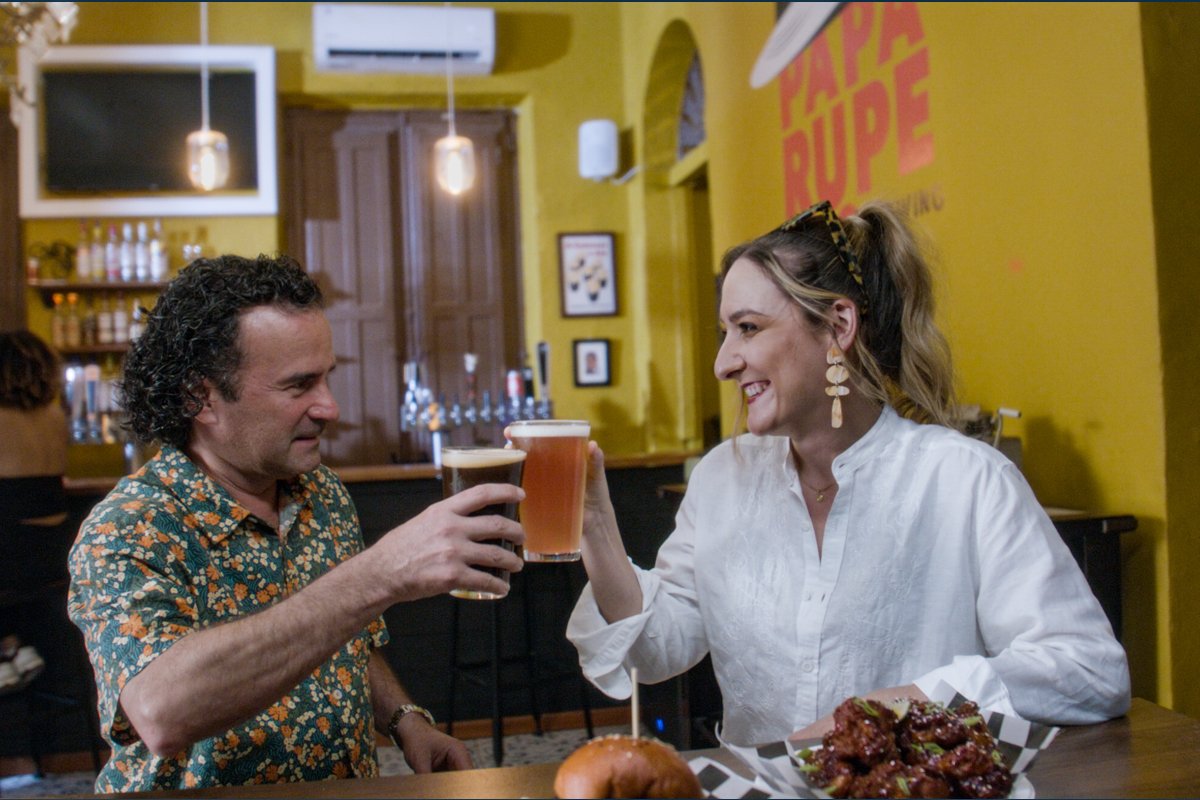 Man and woman drinking beer.