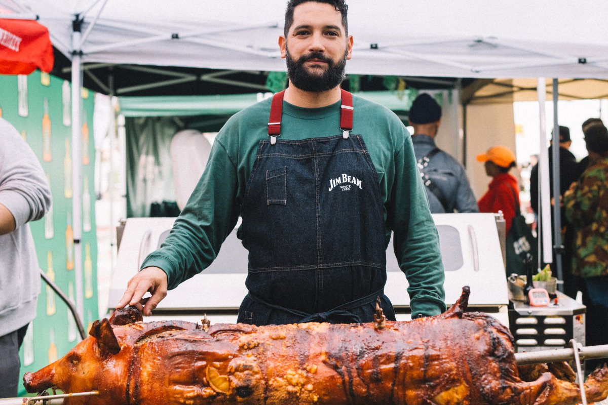 Chef Manolo López roasting a lechón.