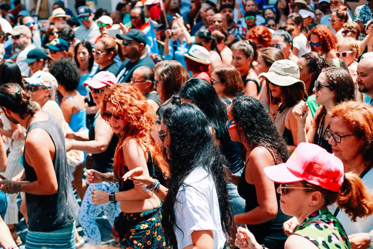 A diverse group of people dancing in the streets