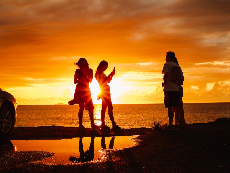 Friends enjoy a beautiful sunset in Aguadilla