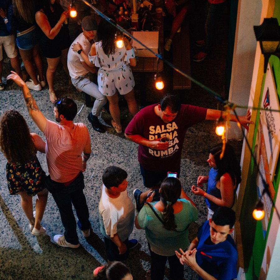 People talking and having a good time in La Placita de Santurce.