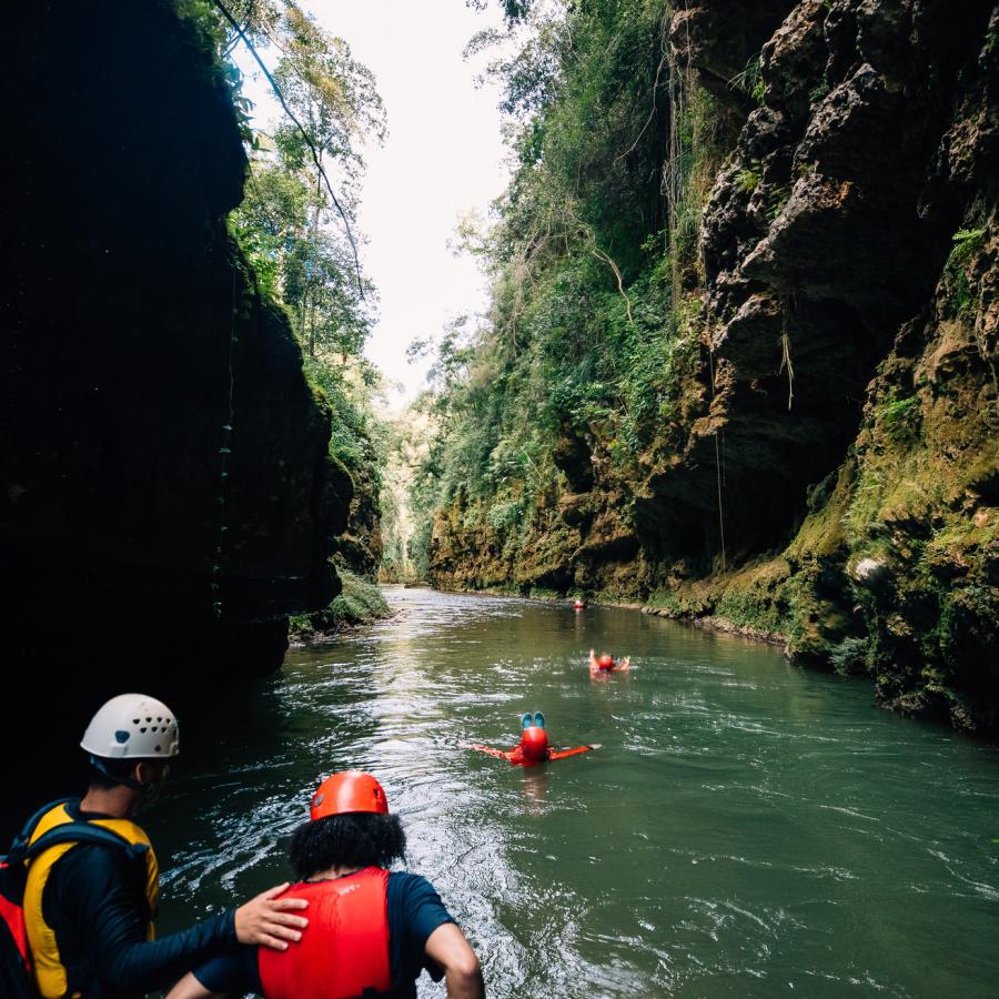 A group navigates the underground Tanama River in Utuado.