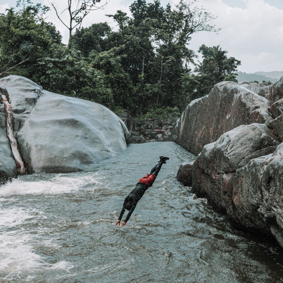 Person jumping into river.