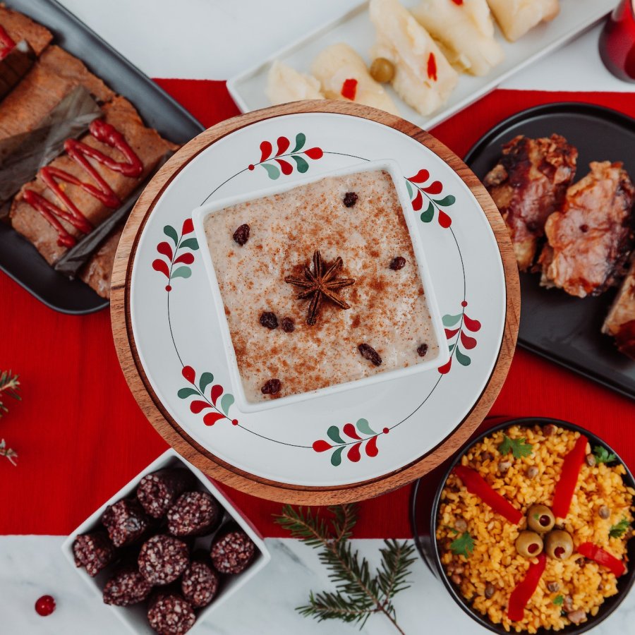 An array of rice, pasteles, and lechon