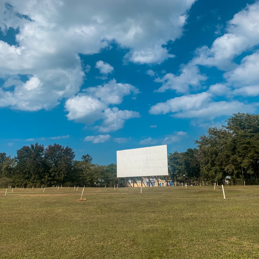 Drive in theater screen in a field.