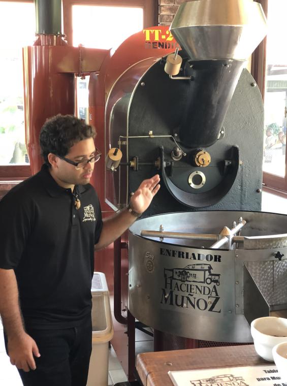 Man explains how the coffee bean is processed in a coffee hacienda.