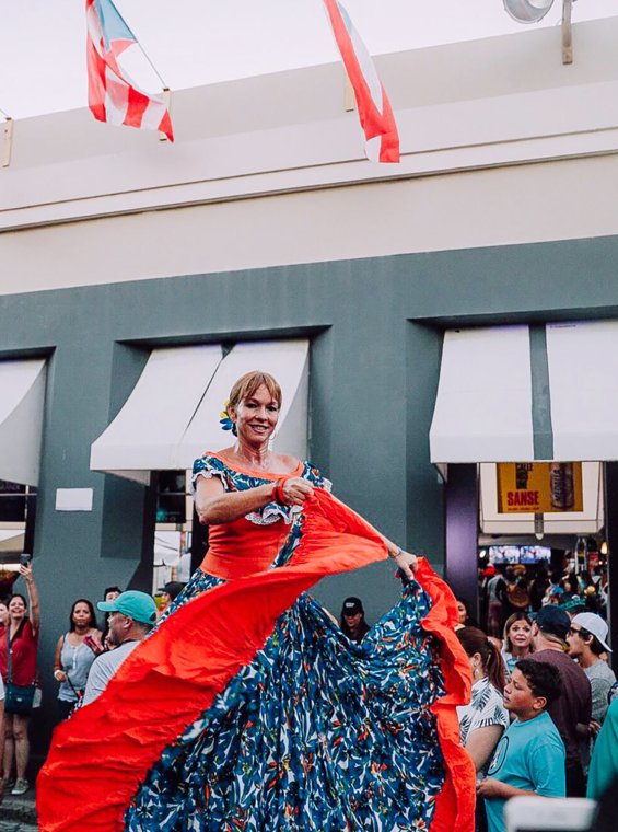 Woman dances bomba at the San Sebastian Street